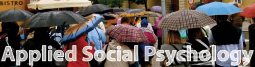 Applied Social Psychology Image of crowd with umbrellas